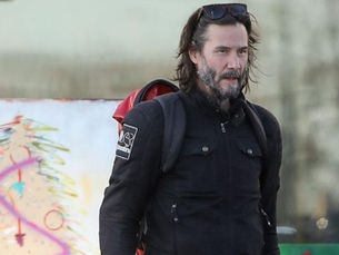 Keanu Reeves spurs motorcyclists looking for a ride in Malibu ahead of last-minute Xmas shopping