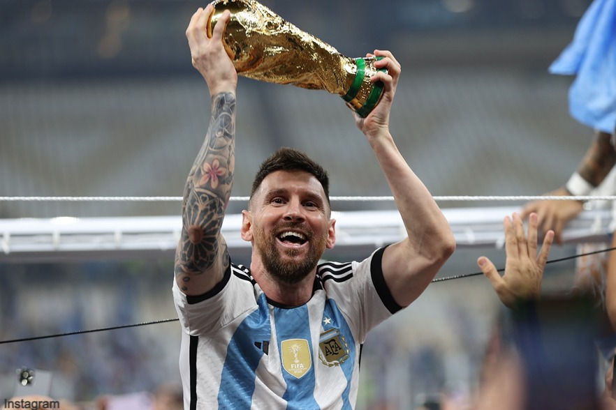 Lionel Messi hoists the World Cup after his side's victory over France in the World Cup final on December 18 at Lusail Stadium [Showkat Shafi/Al Jazeera]