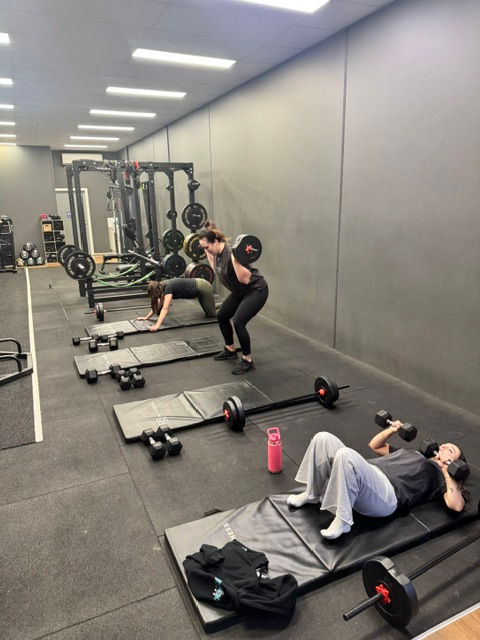 Eye-level view of a community fitness class in a bright studio