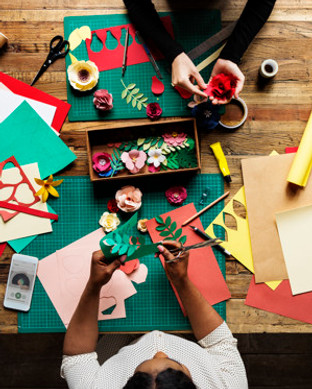aerial-view-of-messy-paper-craft-work-ta