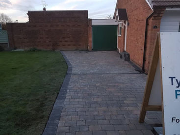 Patio next to a garden