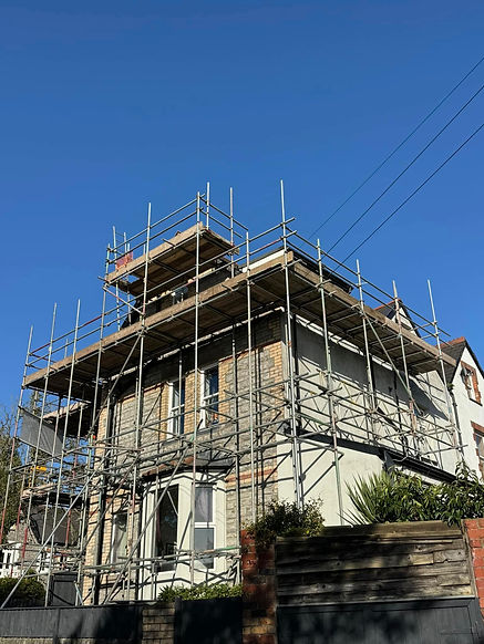House under renovation scaffolding