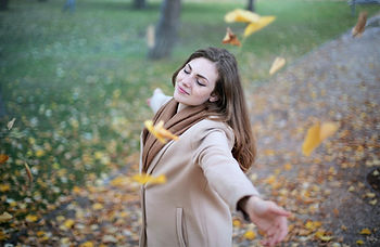 Lady walking in the leaves