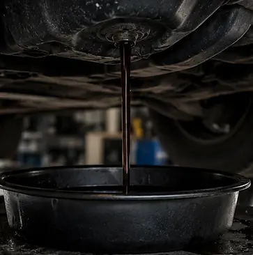 Draining old diesel engine oil during maintenance service in Elmwood Park, NJ