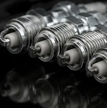 Replacing spark plugs in four cylinder engine during maintenance service