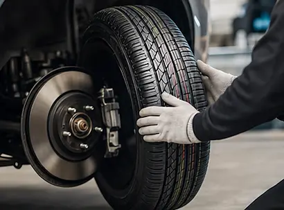 Automotive technician installing new tires in Elmwood Park, NJ