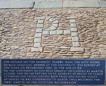 Patrick Hamilton's initials within the cobblestones near to the place of his execution.