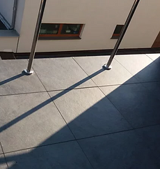 balcony-balustrade-on-the-ceramic-tiles-of-the-ventilated-terrace.png