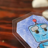 Collectable coin artwork featuring a cartoon Robot character and vivid colors. Created by IW Comics .Shop