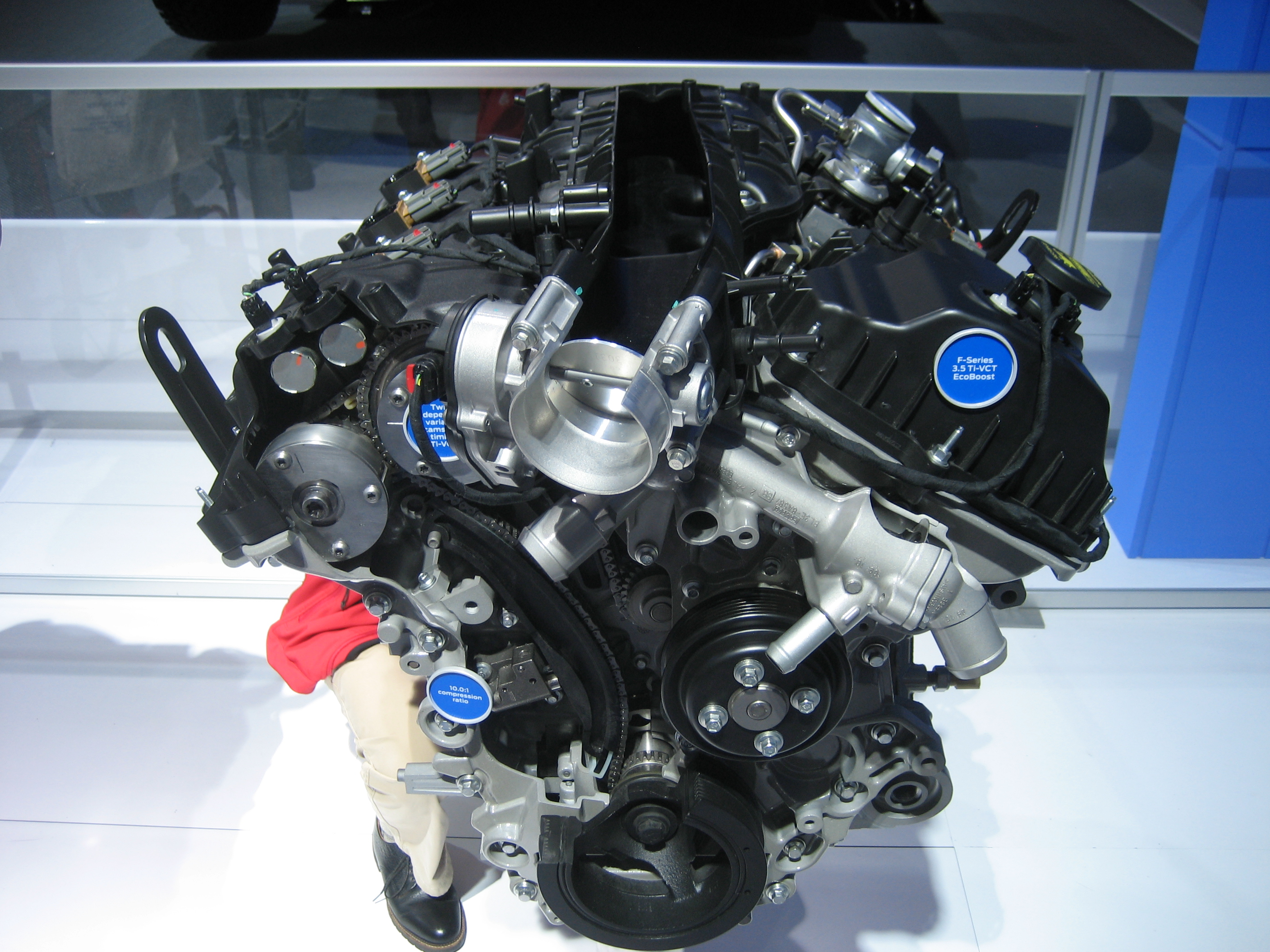 Photograph of an actual Ford 3.5L EcoBoost V6 engine display, not representative of 1.5L and 2.0L layouts