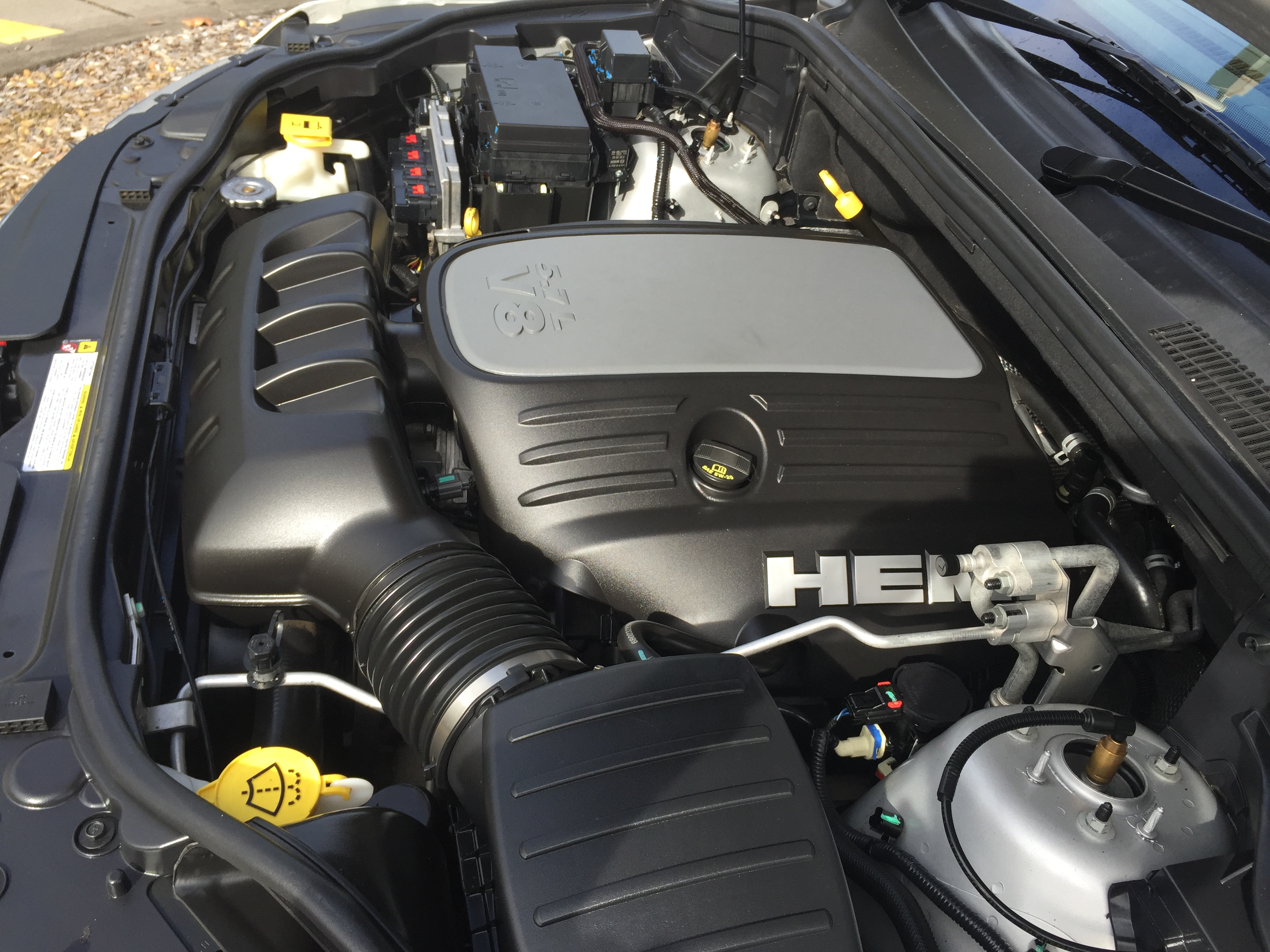 Photograph of a real 5.7L HEMI V8 engine, representative engine family