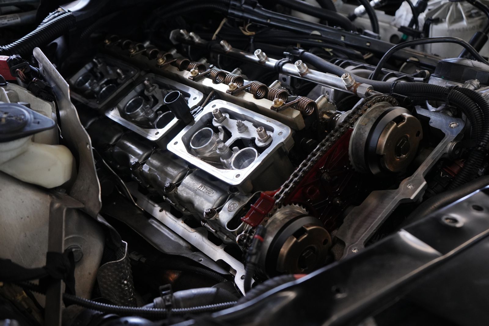 Photographed car engine internal components during disassembly and repair
