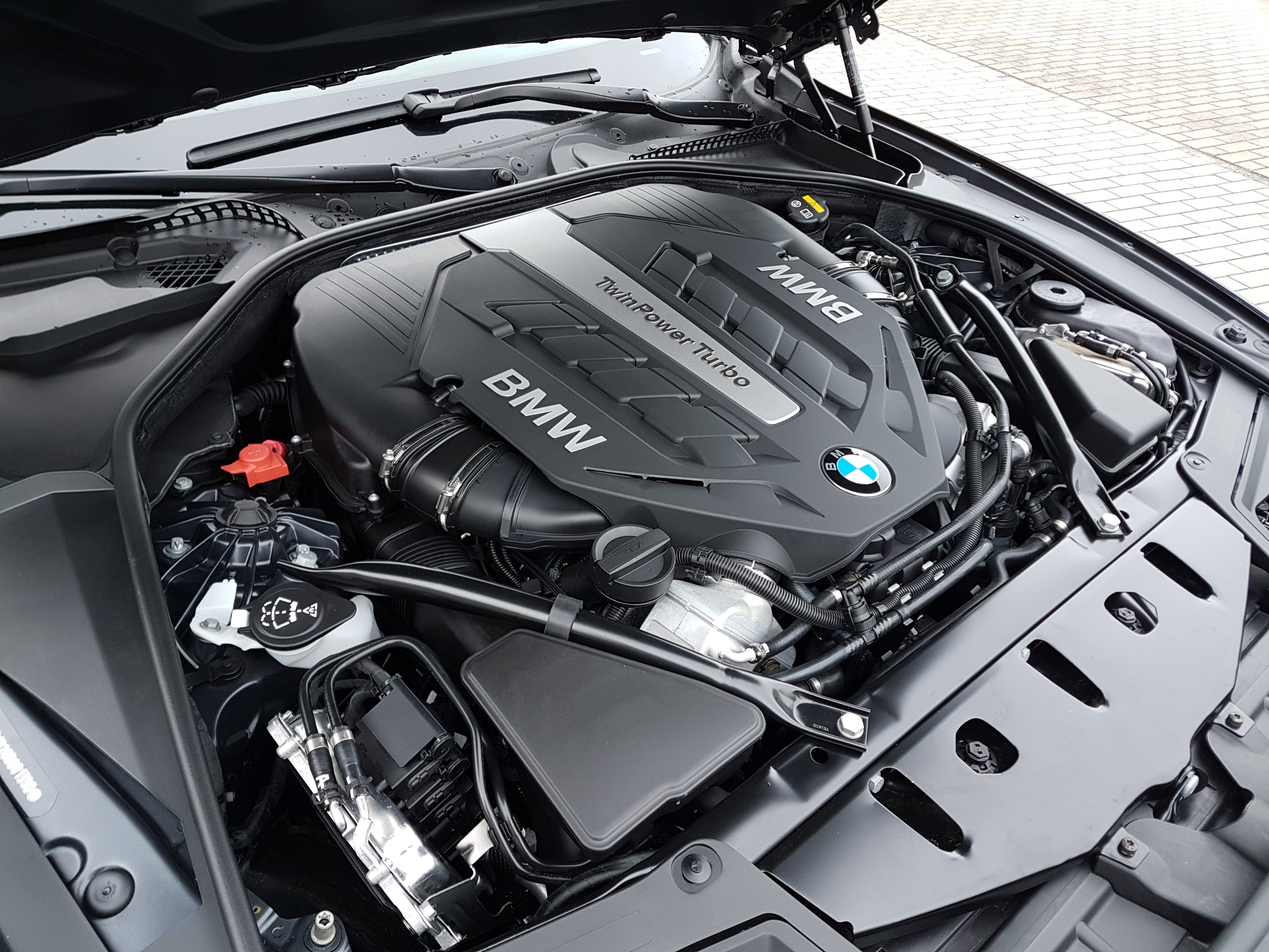 Photograph of a BMW N63 turbocharged V8 engine, relevant to documented N63 oil-consumption concerns