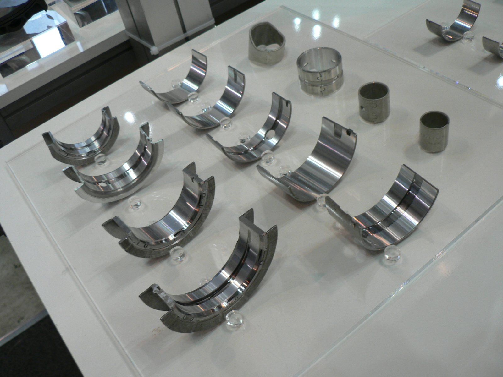 Photographed crankshaft journal bearing shells as an example of internal engine bearing parts, not specifically BMW