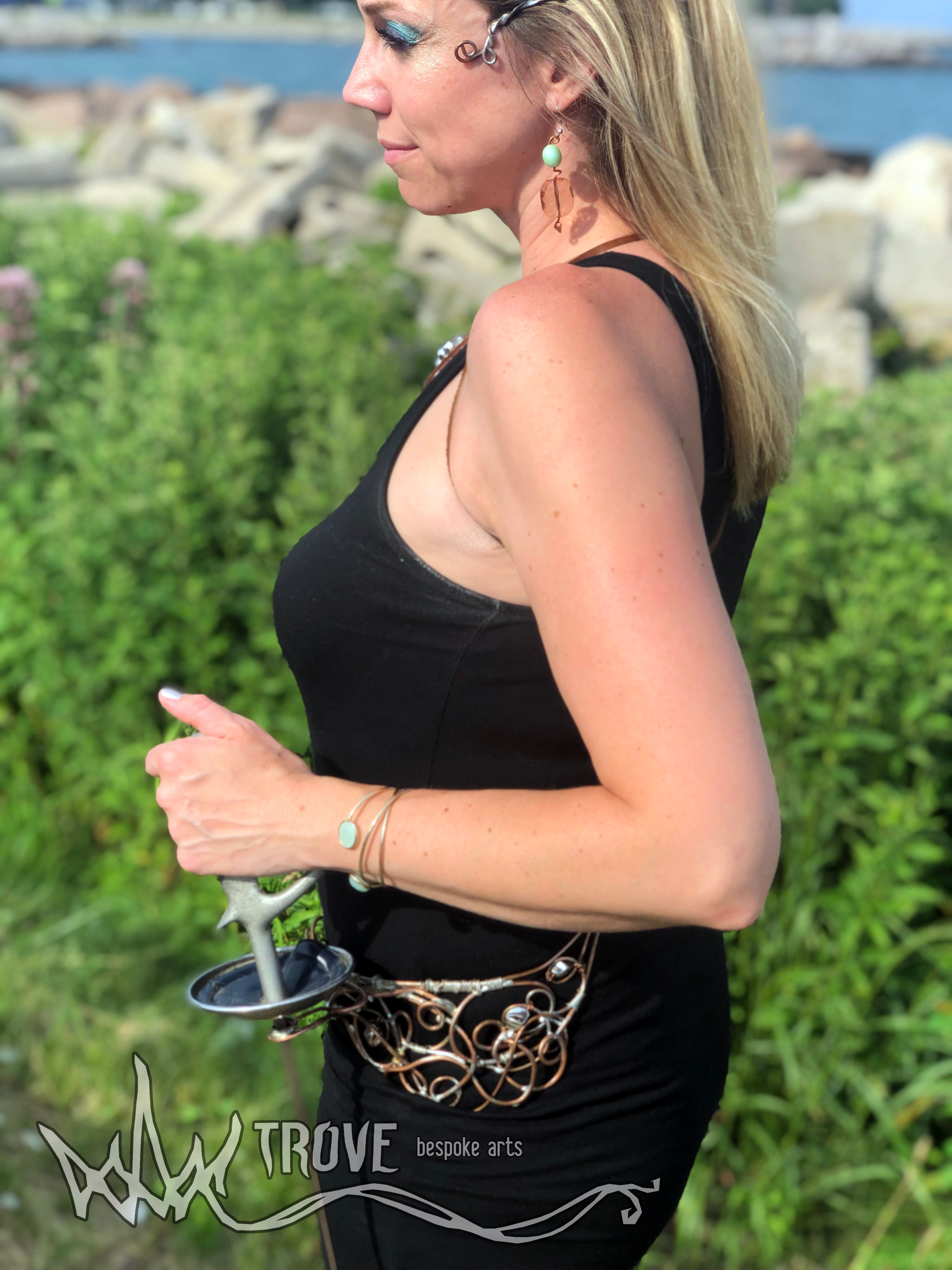 blonde woman with Renaissance fantasy sword belt frog holder