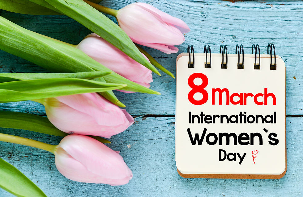 Pink tulips aside a spiral notebook that says '8March International Women's Day