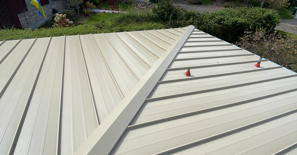 Standing seam metal roof installation with mechanical lock system in Washington State