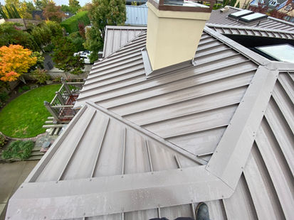 Standing seam metal roof installation with mechanical lock system in Washington State
