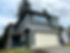 Two-story blue house featuring fresh exterior paint and trim.