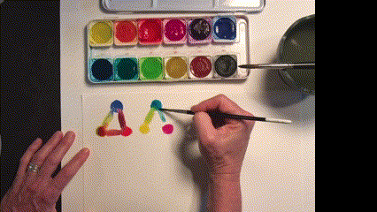 Gif for color explorations with watercolors - woman blends paint together into a triangle shape using watercolors and water.