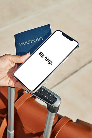 woman-holding-passport-smartphone-with-luggage-airport-pandemic copy.jpg