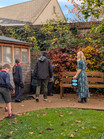 school children and teachers walking through the garden