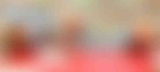 children, staff and residents making bird feeders