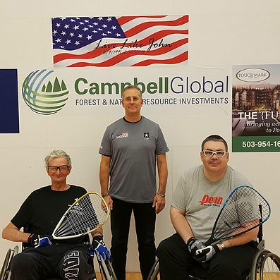 Wendall Pelham with two racquetball players in wheel chairs
