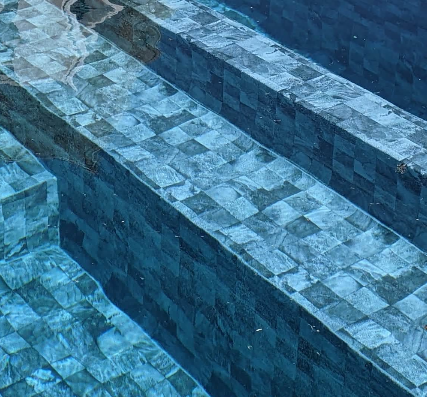Piscine avec plage immergée et ligne d’eau miroir