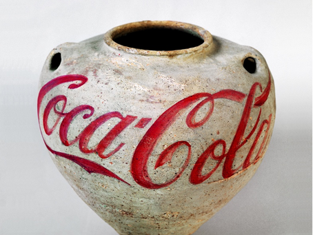 How has the Coca-Cola Company influenced our lives through advertising, art, pop culture, and responses to social and political situations over the years?