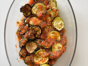 This easy oven-roasted aubergine and zucchini recipe features tender vegetables topped with a fresh garlic tomato sauce. A healthy, vegan, Mediterranean-inspired dish perfect as a light main or flavorful side.