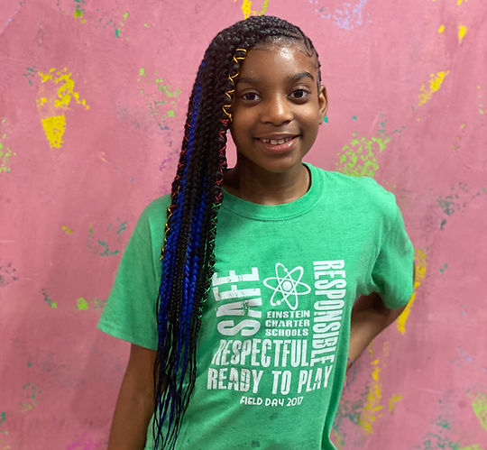A girl with braids, showcasing her hairstyle
