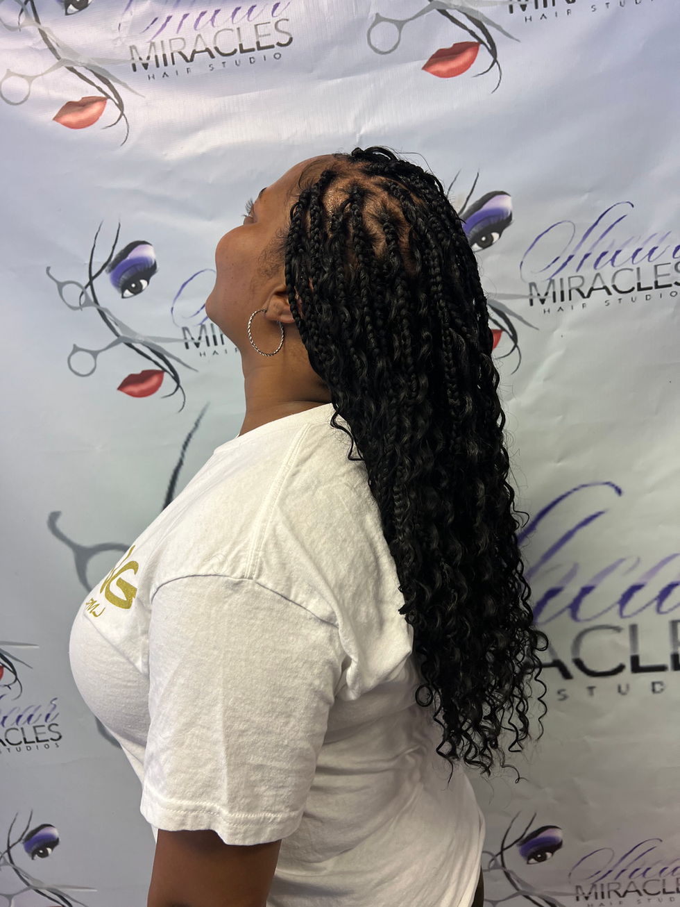 Medium mid-back Boho box braids.HEIC