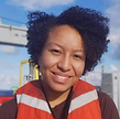 Raquel Bryant portrait. She is wearing an orange life vest