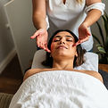 A woman receiving reiki healing.jpg