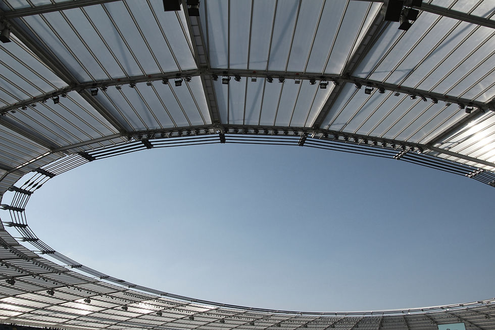 View of the sky through a stadium roof | Sam Gash