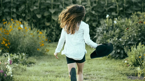 A child playing in the backyard