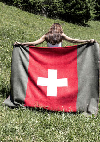 Model Walking in a Field with a Fine Merino Swiss Army Blanket  | Viñas Genève