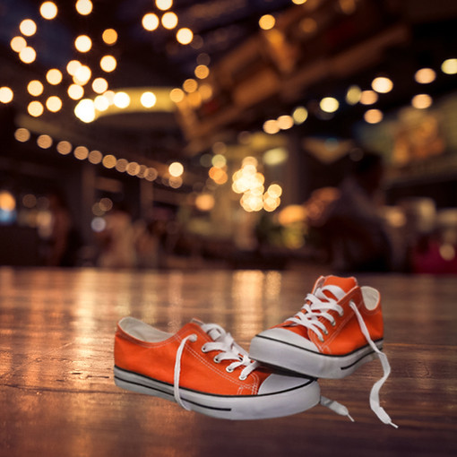 Orange Converse shoes and party lights for an event
