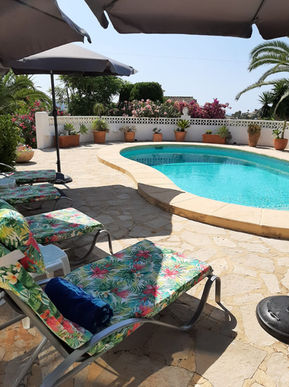 Pool view from sunloungers at your holiday rental villa