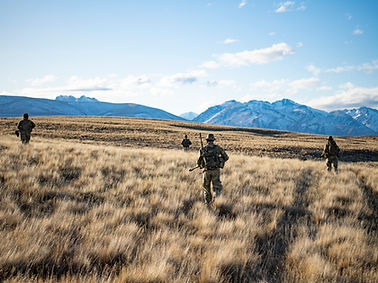 NZ Army soldiers patrolling a desert with latest equipment 