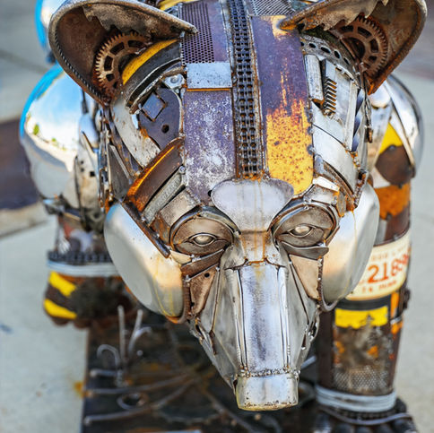 Life size black bear made from reclaimed materials.