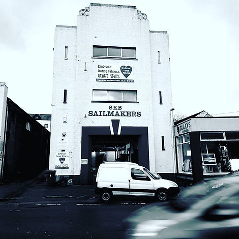 The front of the Fish Factory building from Commercial Road showing our neighbours SKB Sailmakers and Embrace Dance Fitness (upstairs) and Sullys Framing to the right of the building on COMMERCIAL ROAD, PENRYN