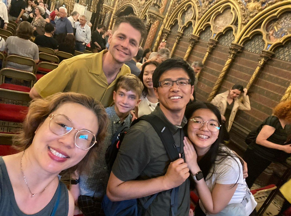 Group selfie inside an ornate hall