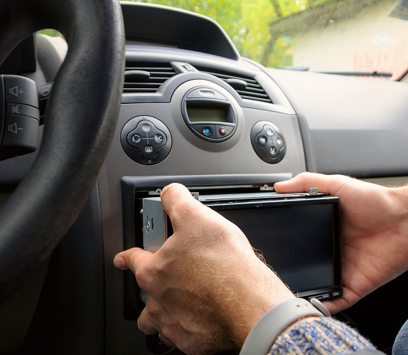 Technician performing audio calibration with test equipment