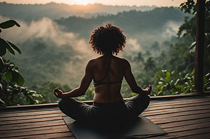 Black woman doing yoga overlooking the jungle in Ubud Bali