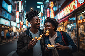 Black couple eating street food in Dotonbori Osaka
