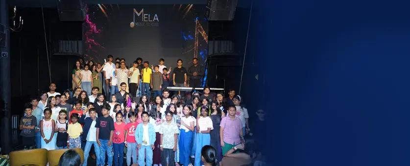 Mela Music School students and teachers at a student concert