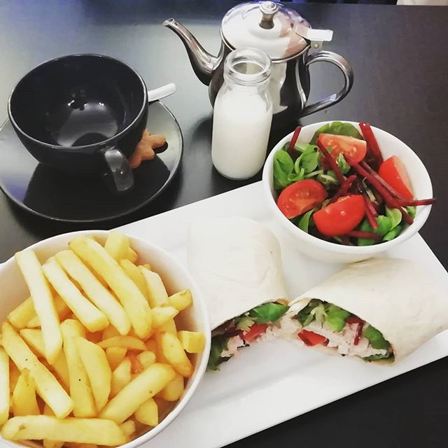 Wrap, chips, salad and a hot drink