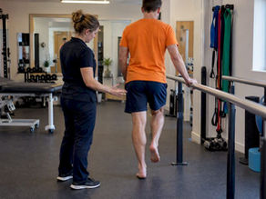 Runner performing calf rehabilitation heel raise